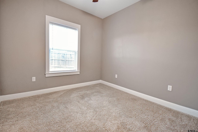 carpeted empty room with ceiling fan