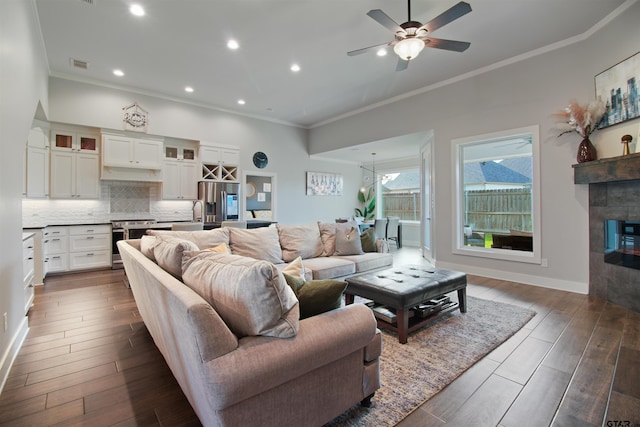 2946 Guinn Farms Rd, Tyler, TX 75707 - living area with ornamental molding, ceiling fan, dark wood finished floors, a fireplace, and recessed lighting