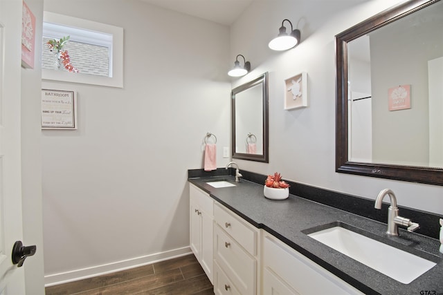 2946 Guinn Farms Rd, Tyler, TX 75707 - bathroom featuring double vanity and wood finished floors