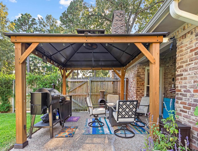 view of patio / terrace with area for grilling and a gazebo