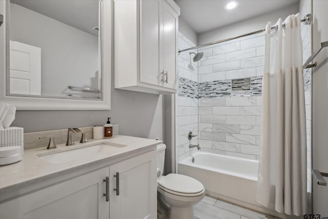 full bath with vanity, toilet, and shower / tub combo with curtain