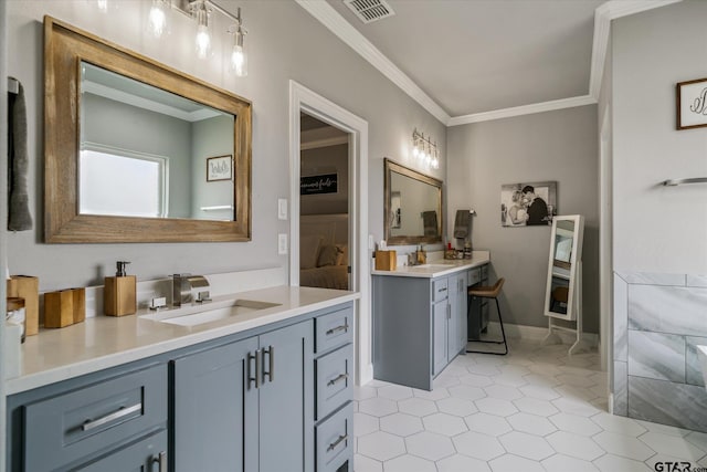 full bath featuring visible vents, crown molding, two vanities, ensuite bathroom, and a sink