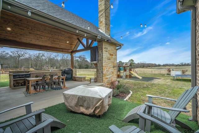 view of patio with fence, area for grilling, outdoor dining area, a playground, and a trampoline