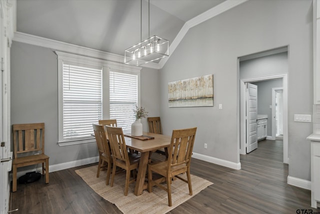 dining room featuring a wealth of natural light, lofted ceiling, and dark wood finished floors