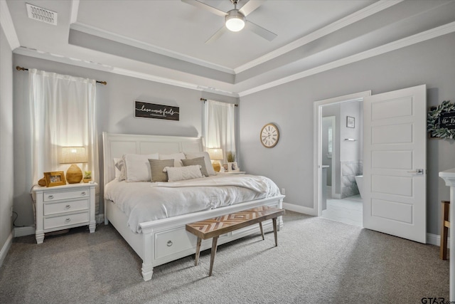 bedroom featuring visible vents, a raised ceiling, carpet flooring, and crown molding