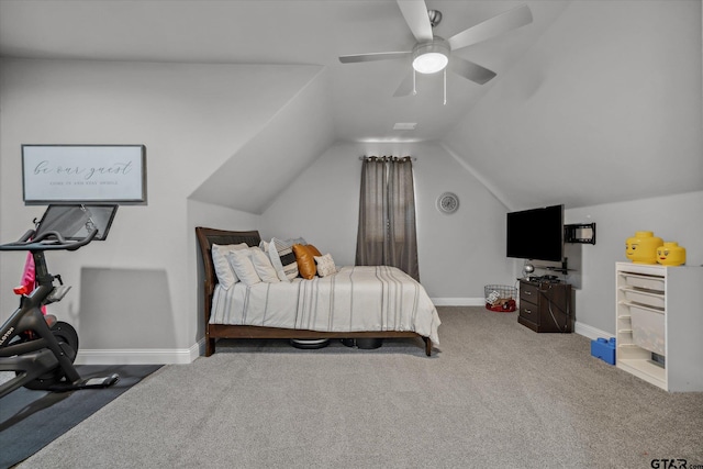 carpeted bedroom with vaulted ceiling, baseboards, and ceiling fan