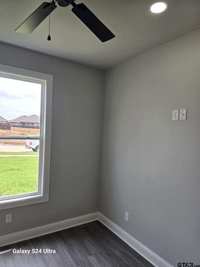 empty room with baseboards, a ceiling fan, dark wood-style floors, and recessed lighting