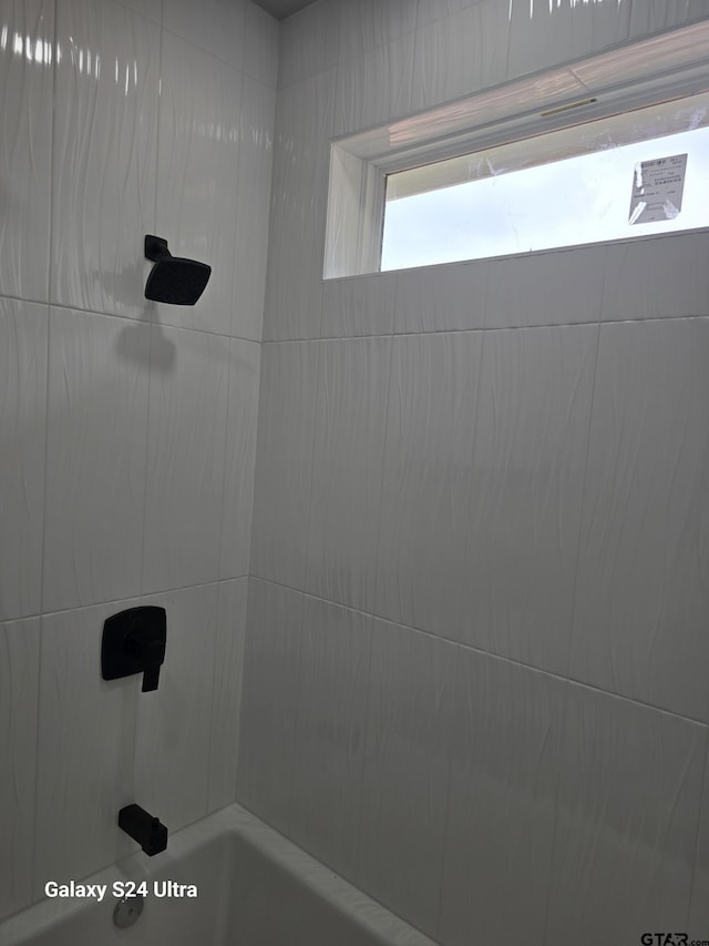 full bath featuring tub / shower combination