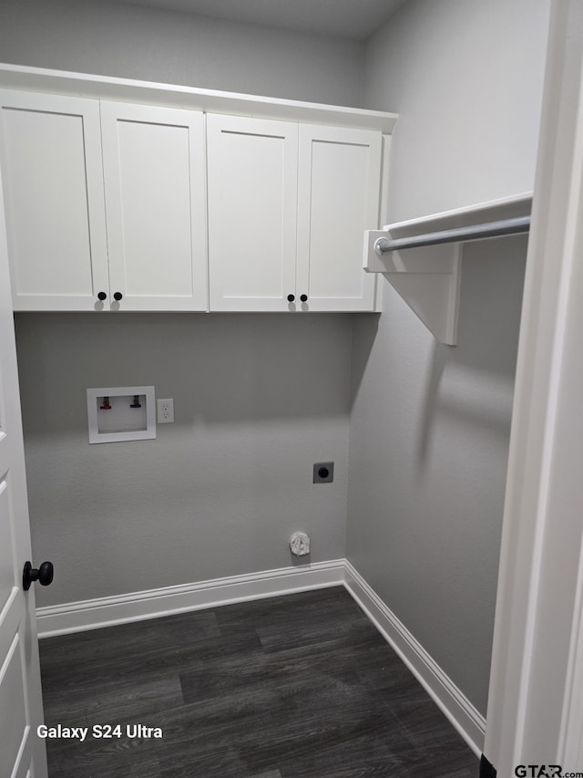 laundry area featuring washer hookup, hookup for an electric dryer, cabinet space, baseboards, and dark wood-type flooring