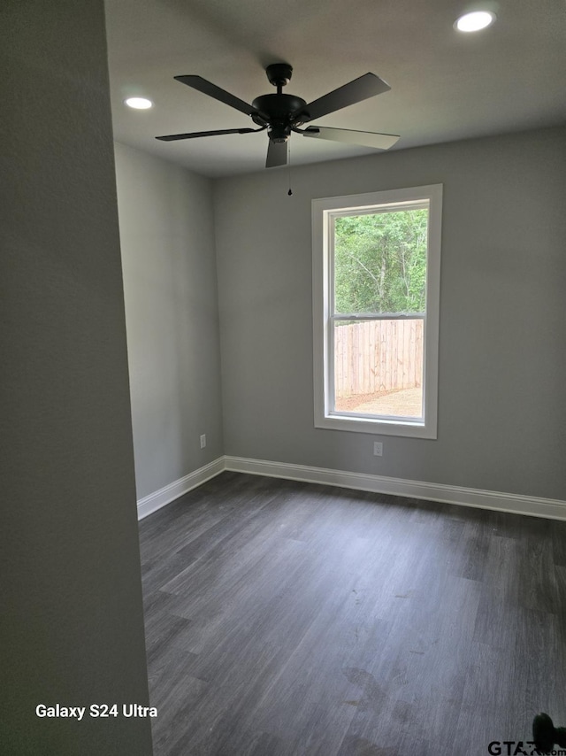 empty room with dark wood-style flooring, ceiling fan, recessed lighting, and baseboards