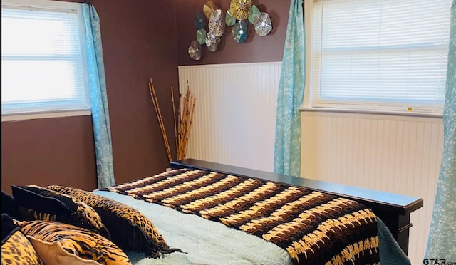 102 Indianola Rd, Chandler, TX 75758 - bedroom featuring a wainscoted wall