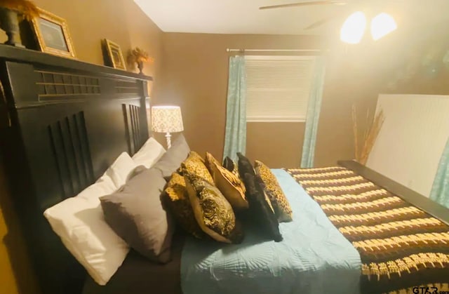 102 Indianola Rd, Chandler, TX 75758 - bedroom featuring a ceiling fan