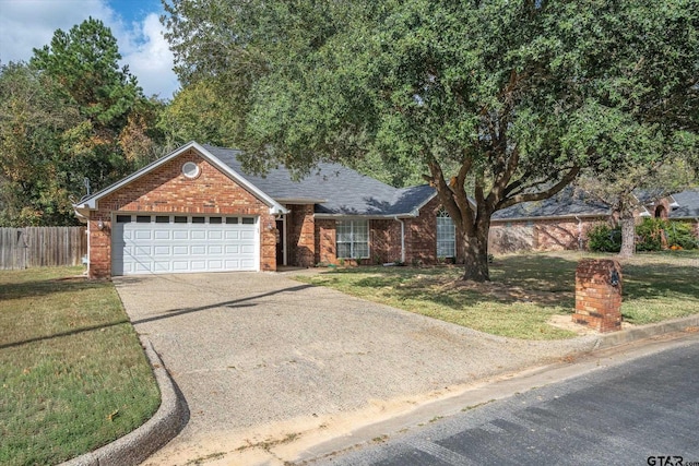 view of front of house with a garage and a front lawn