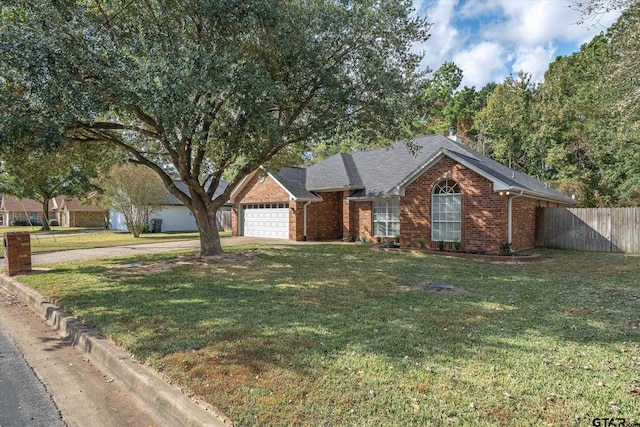 single story home with a garage and a front yard