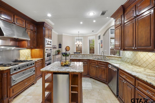 2322 Kingsmill Cir, Tyler, TX 75703 - kitchen with stainless steel appliances, a warming drawer, under cabinet range hood, recessed lighting, and crown molding