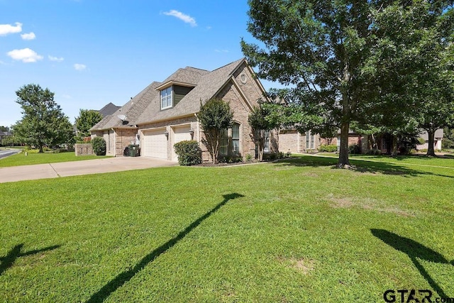2322 Kingsmill Cir, Tyler, TX 75703 - view of front of property featuring brick siding, driveway, a front yard, and an attached garage
