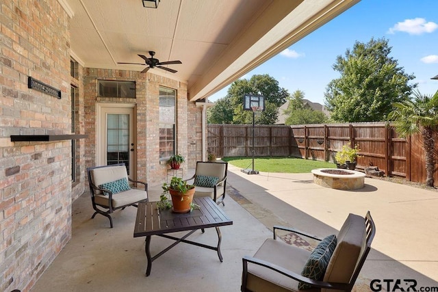 2322 Kingsmill Cir, Tyler, TX 75703 - fenced backyard with a ceiling fan, a patio area, and an outdoor living space with a fire pit