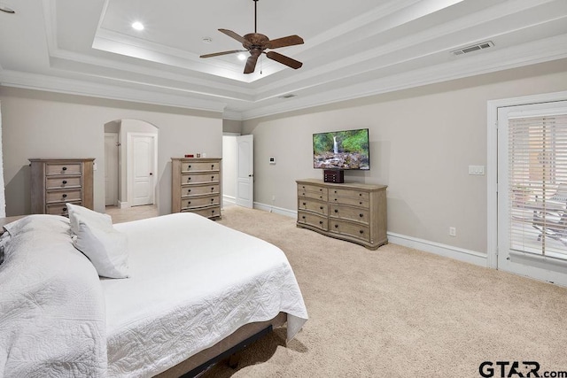 2322 Kingsmill Cir, Tyler, TX 75703 - bedroom featuring a raised ceiling, arched walkways, light carpet, access to outside, and ornamental molding