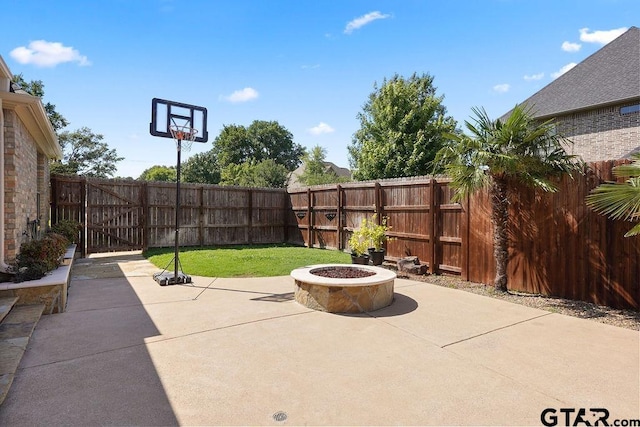 2322 Kingsmill Cir, Tyler, TX 75703 - fenced backyard featuring a patio area and a fire pit