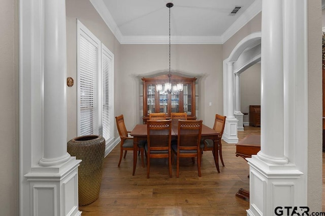 2322 Kingsmill Cir, Tyler, TX 75703 - dining room with ornate columns, dark wood-style flooring, crown molding, and a chandelier