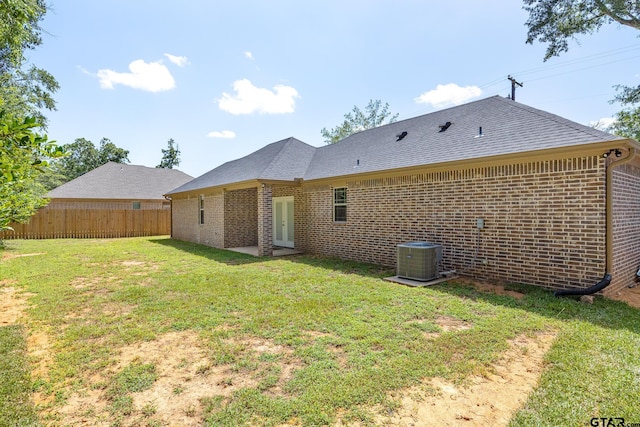 1720 Outer Dr, Tyler, TX 75701 - back of property with brick siding and a shingled roof