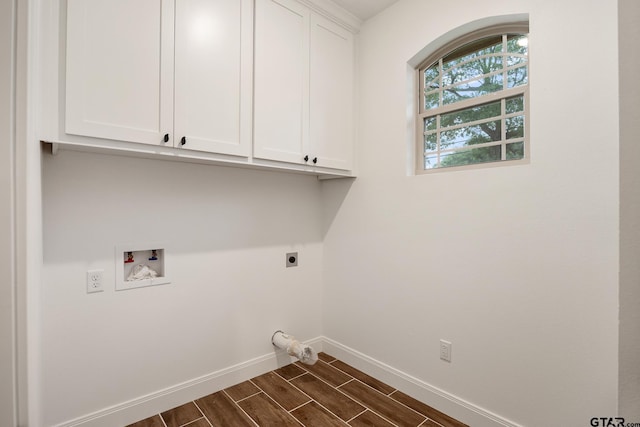 1720 Outer Dr, Tyler, TX 75701 - washroom featuring cabinet space, hookup for an electric dryer, hookup for a washing machine, and wood tiled floors
