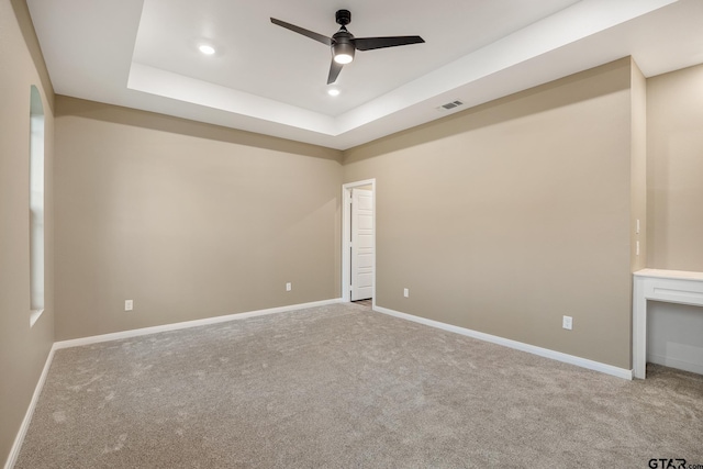 1720 Outer Dr, Tyler, TX 75701 - carpeted empty room featuring ceiling fan, recessed lighting, and a raised ceiling