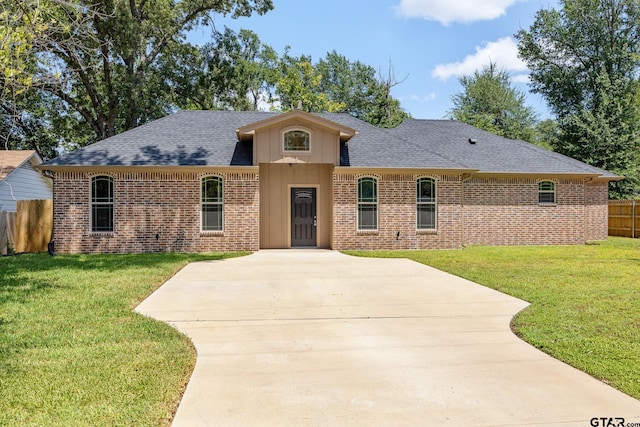 1720 Outer Dr, Tyler, TX 75701 - ranch-style home with brick siding, a shingled roof, and driveway