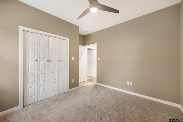 1720 Outer Dr, Tyler, TX 75701 - unfurnished bedroom featuring carpet, a closet, and a ceiling fan
