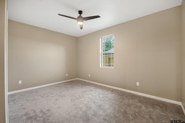 1720 Outer Dr, Tyler, TX 75701 - unfurnished room with ceiling fan and carpet floors