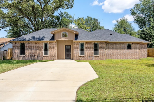 1720 Outer Dr, Tyler, TX 75701 - ranch-style home featuring brick siding, a shingled roof, driveway, and board and batten siding