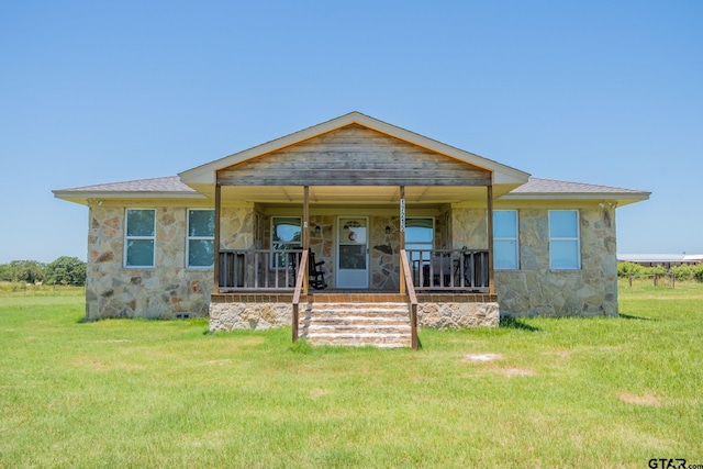 17215 Tartlon Rd, Mabank, TX 75147 - bungalow-style home featuring stone siding, a porch, and a front yard