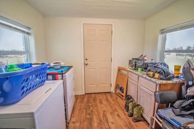 17215 Tartlon Rd, Mabank, TX 75147 - laundry room featuring cabinet space, light wood finished floors, washing machine and dryer, healthy amount of natural light, and ornamental molding