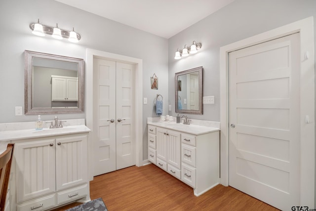 bathroom with vanity and hardwood / wood-style floors