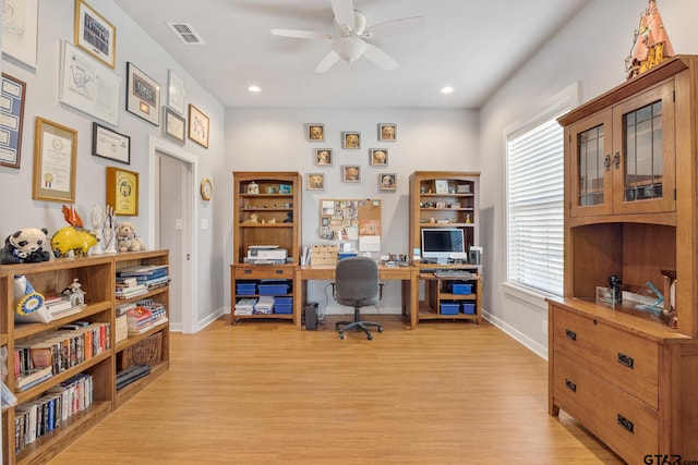 home office featuring ceiling fan and light hardwood / wood-style flooring