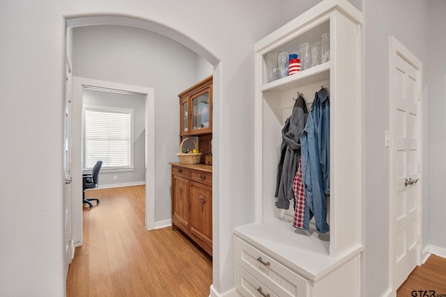 mudroom with light hardwood / wood-style floors