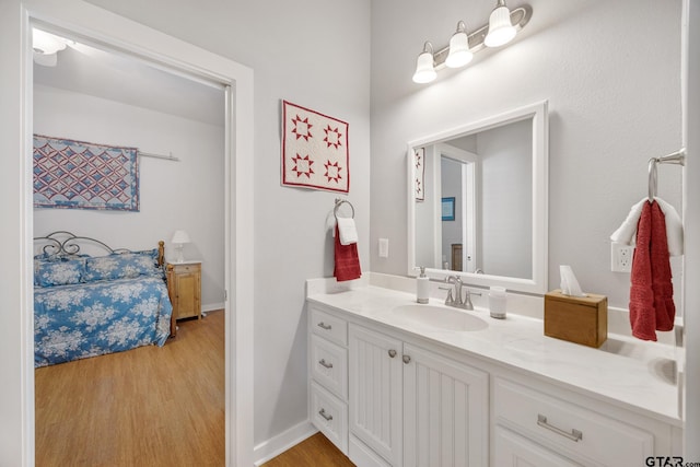 bathroom featuring hardwood / wood-style flooring and vanity