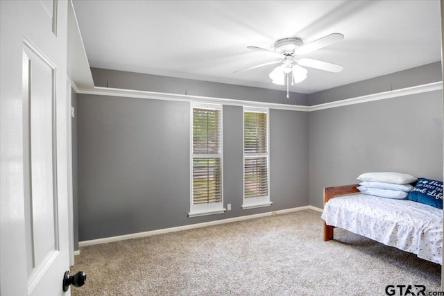 1216 Kingspark Dr, Tyler, TX 75703 - carpeted bedroom with baseboards and a ceiling fan