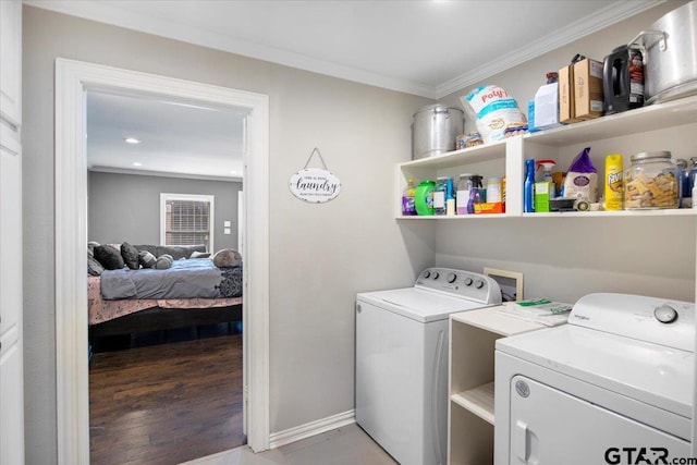1216 Kingspark Dr, Tyler, TX 75703 - laundry area with ornamental molding, laundry area, washing machine and dryer, and baseboards