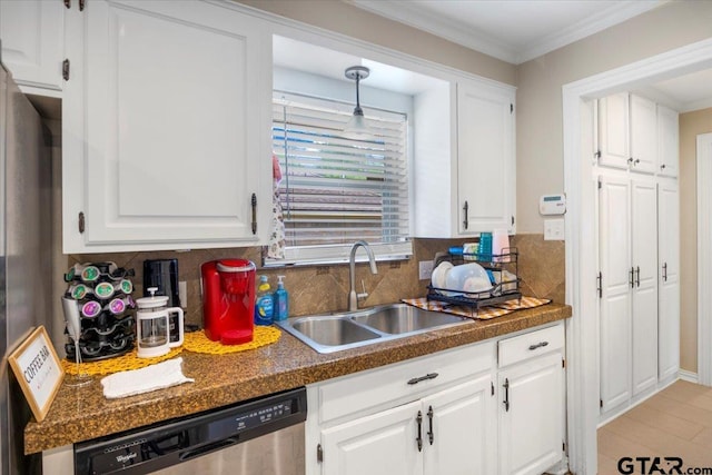 1216 Kingspark Dr, Tyler, TX 75703 - kitchen with backsplash, white cabinets, a sink, and dishwasher