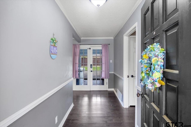 1216 Kingspark Dr, Tyler, TX 75703 - doorway with french doors, a textured ceiling, visible vents, dark wood finished floors, and baseboards