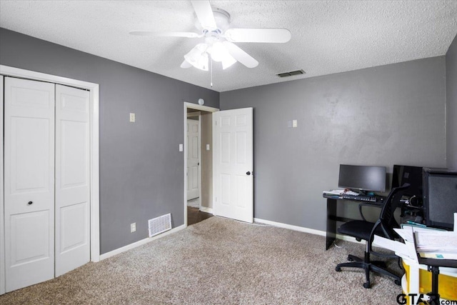 1216 Kingspark Dr, Tyler, TX 75703 - carpeted home office featuring a textured ceiling, baseboards, a ceiling fan, and visible vents