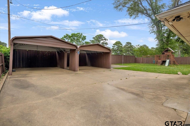 1216 Kingspark Dr, Tyler, TX 75703 - garage with a detached carport and fence
