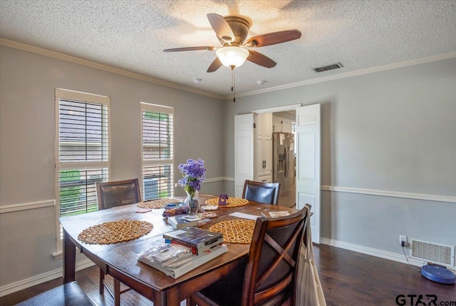 1216 Kingspark Dr, Tyler, TX 75703 - dining area with dark wood-style flooring, a textured ceiling, ceiling fan, and visible vents