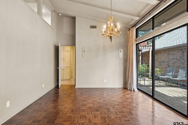 spare room featuring a chandelier, dark parquet flooring, and vaulted ceiling with beams