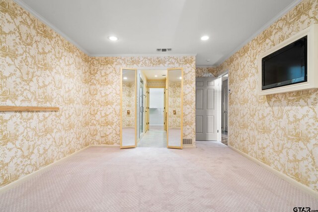 carpeted spare room with ornamental molding