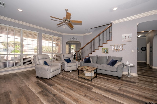 living room with crown molding, dark hardwood / wood-style floors, and ceiling fan