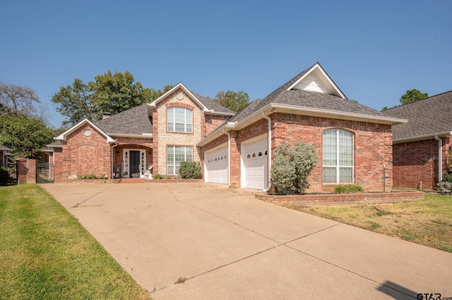 front of property featuring a garage and a front yard