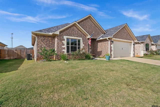 ranch-style house with cooling unit, a front lawn, and a garage