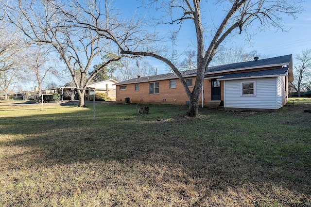 back of house with a yard